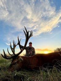 Client with a great red stag trophy