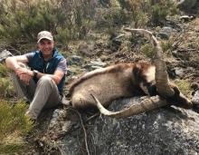 A hunter with his trophy Gredos Ibex