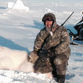 Hunter with a Polar Bear Trophy