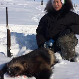 Hunter with wolverine trophy