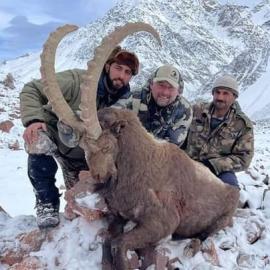 Hunters with a big ibex