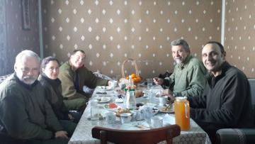 Hunters having dinner at base camp