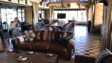 Free-range red stag seating area in lodge